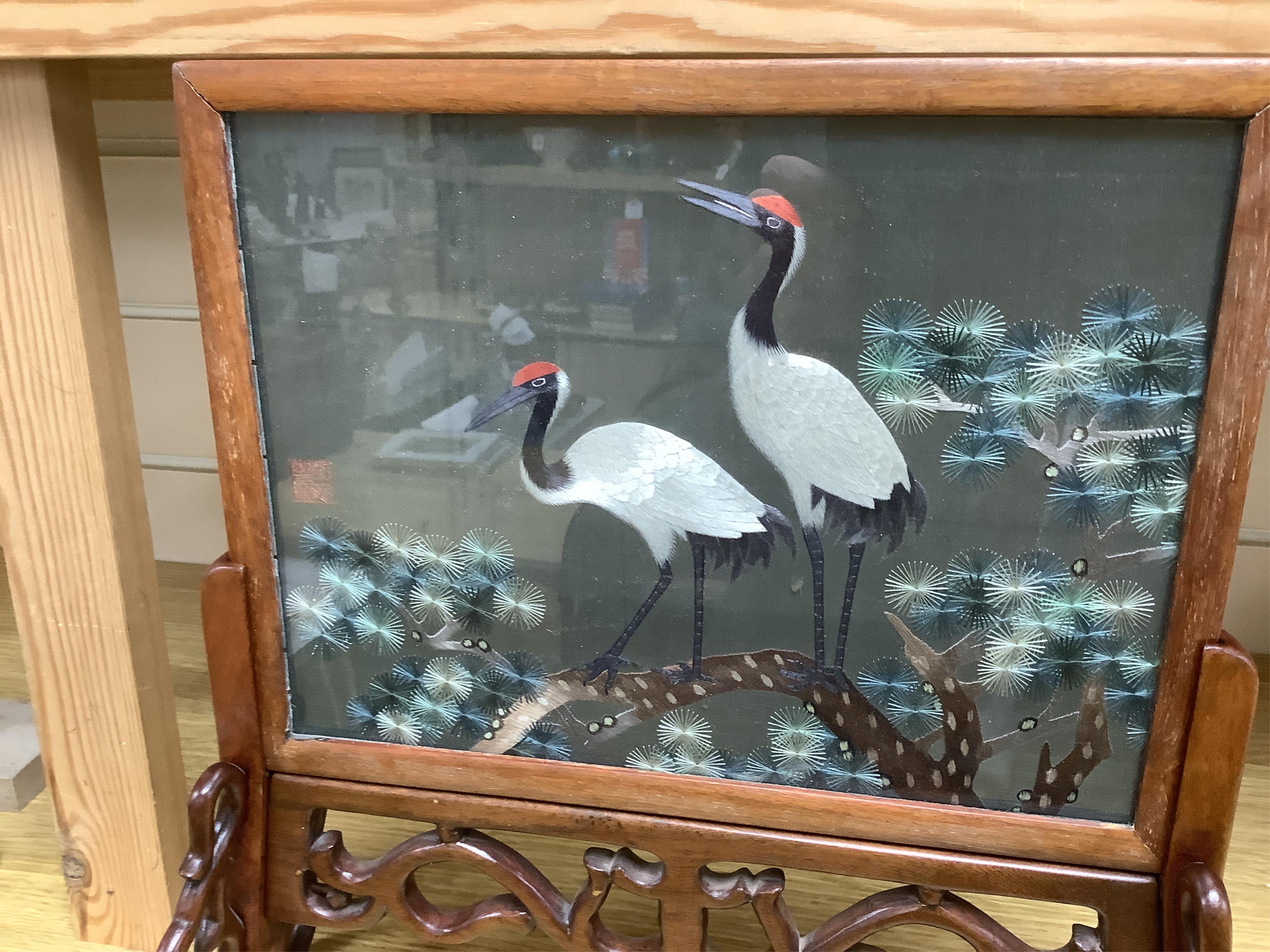 A Chinese hardwood double-sided silk table screen, 32cm tall. Condition - fair to good